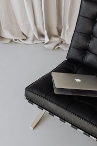 Kaboompics - Laptop sits on a black leather chair - Barcel