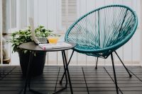 Kaboompics - A stylish garden chair and a small table on the balcony