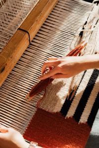 Kaboompics - Woman working on a loom