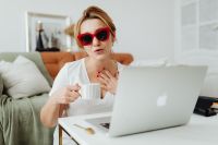 Kaboompics - Woman using laptop and making video call at home