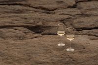 Kaboompics - Coastal Elegance - White Wine on the Rocky Shores of Malta