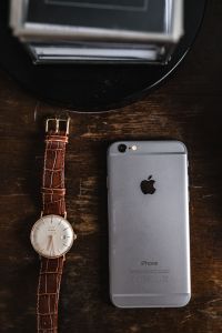 Kaboompics - Apple iPhone 6 and Vintage watch on a brown leather wallet