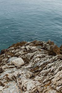 Rocky coastline on the Adriatic Sea in the small town of Rovinj, Croatia