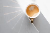 Cup of coffee on white marble