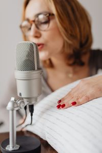 Kaboompics - Woman Recording ASMR Sounds On Microphone