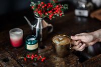 Kaboompics - Cup of coffee, Fresh Holly and Candles