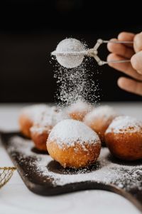 Kaboompics - Homemade Polish doughnuts with cherry filling, covered with powdered sugar. Traditional speciality on Fat Thursday in Poland.