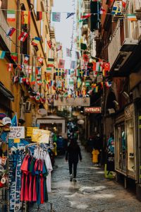 Kaboompics - Narrow street with flags of various countries, Naples
