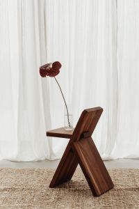Kaboompics - Blooming Flower in Vase on Wooden Chair - A Charming Still Life Collection