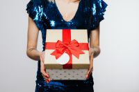 Kaboompics - Woman in Blue Dress Holds a Gift