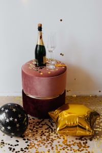 Kaboompics - New Year's Eve - Gold balloon, confetti, bottle of champagne