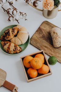 Kaboompics - Orange - croissant - cutting board ona table