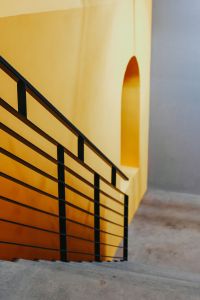 Kaboompics - Staircase by a yellow wall
