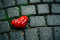 Kaboompics - Small red heart on a cobblestone path