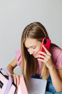 Young girl uses phone