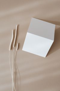 Kaboompics - Blank card & dried grass on beige background
