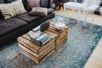 Kaboompics - Designer living room interior with a wooden box table and a light blue carpet