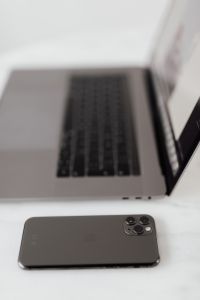 Kaboompics - MacBook Pro 15 laptop and iPhone 11 Pro on a marble table