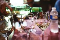 Kaboompics - Pouring white wine into glasses
