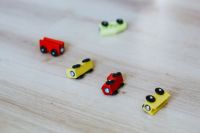 Kaboompics - Wooden car toys on the floor