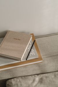 Kaboompics - Home office on the sofa - books - notebook - organizer - planner