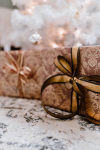 Kaboompics - elegantly wrapped gifts with golden ribbon