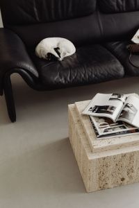 Kaboompics - De Sede DS-2011 Black Leather Two Leather Sofa - Travertine Furniture - Table - Vogue Magazine