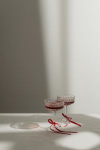 Elegant Toast - Vintage Wine Glasses with Red Ribbon Accents
