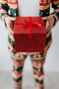 Kaboompics - Close up of man wearing a Christmas suit and hand holding red box