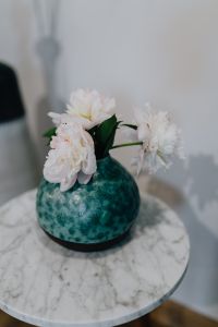 Kaboompics - Peony flowers in vase on marble table