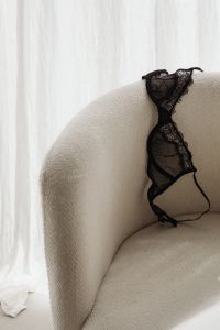 Kaboompics - Black lace bra with underwire lies on the chair