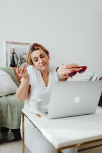 Kaboompics - Woman using laptop and making video call at home