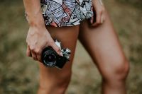 Kaboompics - Woman in a dress with a camera