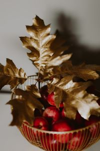 Red apples and golden oak leaves