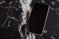 Broken Mobile on Marble Table