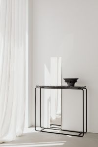 Kaboompics - Black ceramic vase - mirror - black Nero Marquina marble console