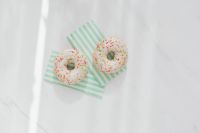 Kaboompics - Donuts on paper napkins placed on white marble