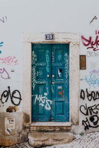 Colorful wooden door in the facade of a typical Portuguese house at Lisbon, Portugal
