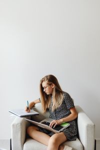 Kaboompics - A young girl uses a laptop