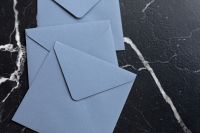 Blue envelopes on marble
