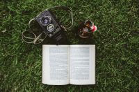 Kaboompics - Book on the grass with a vintage camera