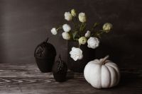 Kaboompics - Dark mood home decorations with flowers & pumpkin