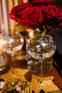 New Year's Eve party - wine glasses, red roses