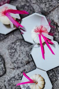 Kaboompics - Decorative white pumpkin trinkets with ribbons on the floor