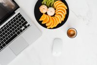Kaboompics - Macbook Laptop, donuts, fruit & coffee