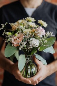 Kaboompics - A man keeps a bouquet in a vase