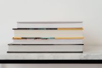 Kaboompics - Books On Marble Table, White Background