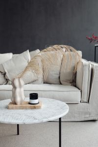 Kaboompics - Marble round table - linen sofa - beige - living room - vase - candle - dries