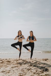 Kaboompics - Women exercising on the beach