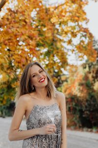 Kaboompics - Blond Woman in a Sequin Dress is Holding a Glass of Champagne, Autumn